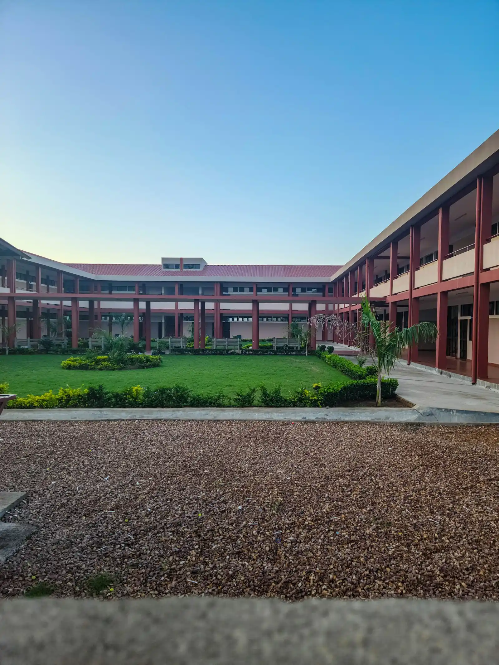 Exterior of a modern school building with entrance and landscaping